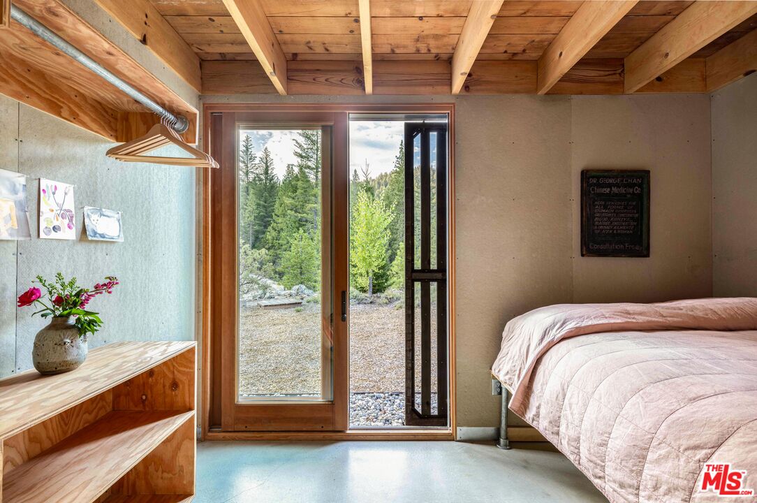 12789 Sailor Flat Road Nevada City, CA 95959 - Photo 15 of 42 a bedroom with a bed and a window