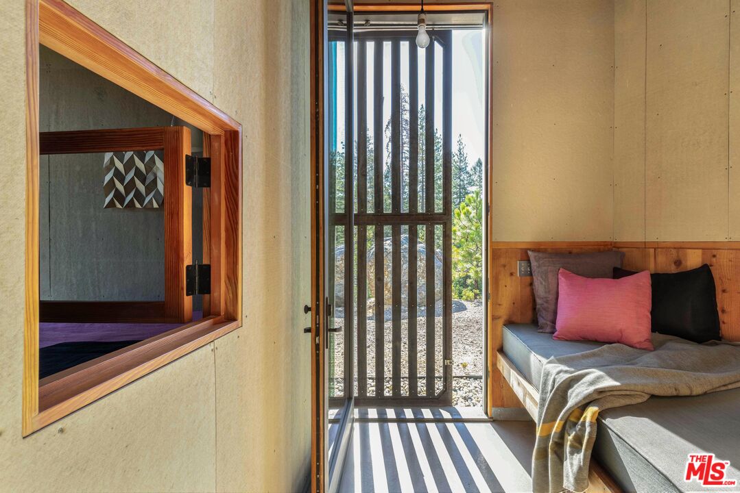 12789 Sailor Flat Road Nevada City, CA 95959 - Photo 18 of 42 a bedroom with a bed and a window