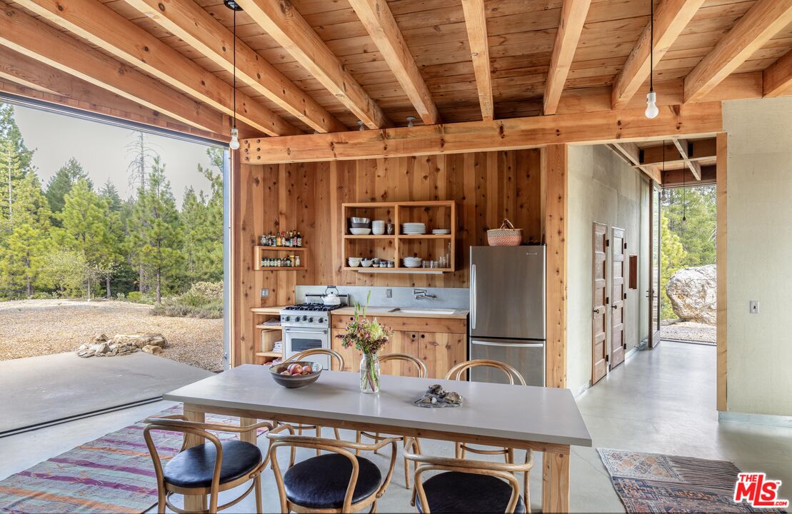 12789 Sailor Flat Road Nevada City, CA 95959 - Photo 26 of 42 a dining table with chairs and window