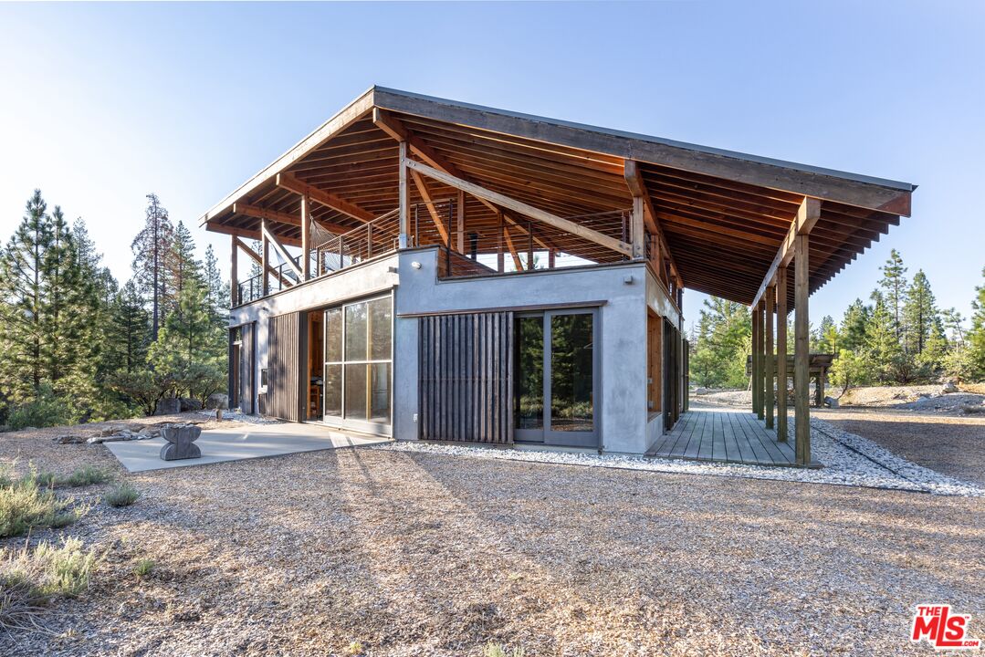 12789 Sailor Flat Road Nevada City, CA 95959 - Photo 4 of 42 a front view of a house with basket ball court and outdoor seating
