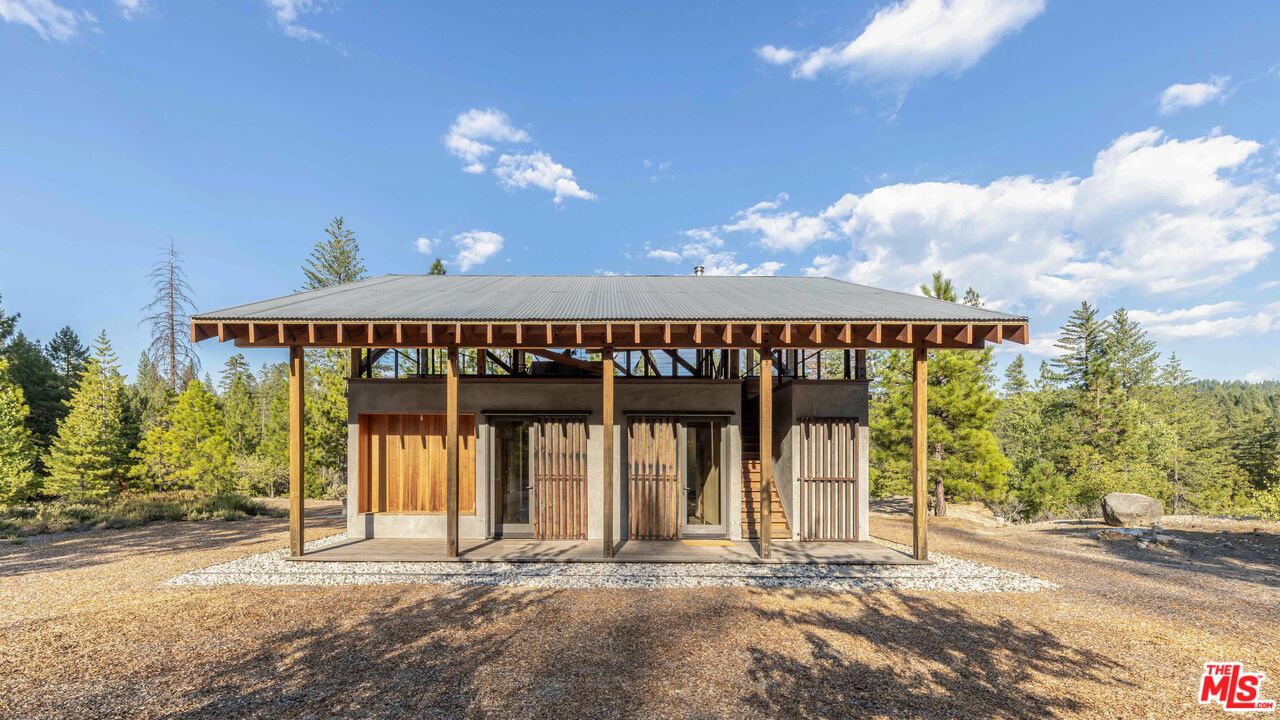 12789 Sailor Flat Road Nevada City, CA 95959 - Photo 7 of 42 a view of a house with a porch and furniture