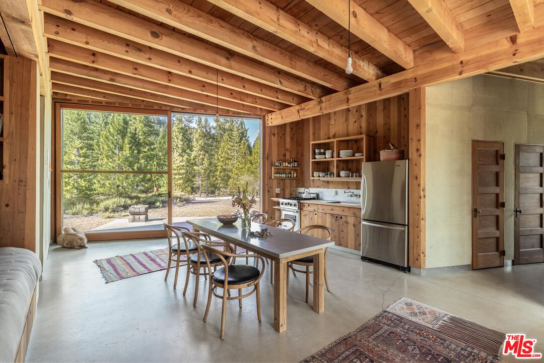 12789 Sailor Flat Road Nevada City, CA 95959 - Photo 9 of 42 a dining room with furniture and large windows