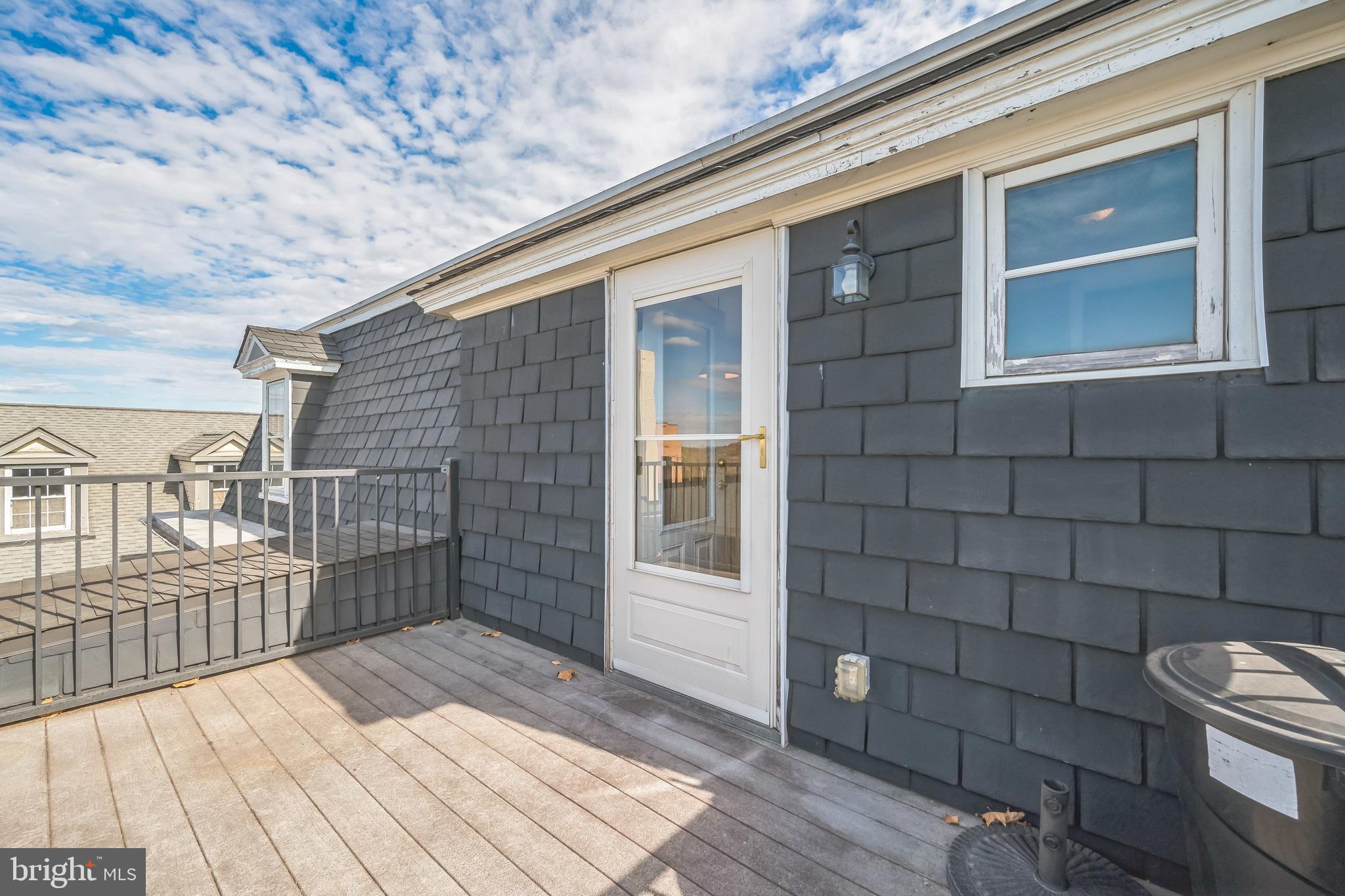 37 South Prospect Street, Unit 401 Hagerstown, MD 21740 - Photo 13 of 15 a view of a brick house with many windows