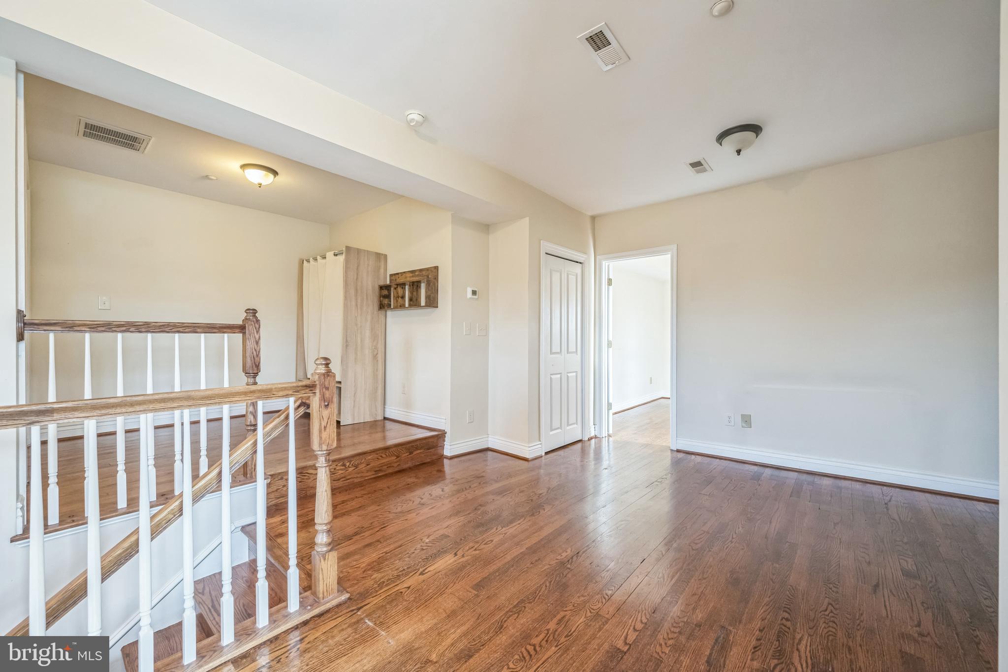 37 South Prospect Street, Unit 401 Hagerstown, MD 21740 - Photo 4 of 15 a view of an empty room with wooden floor