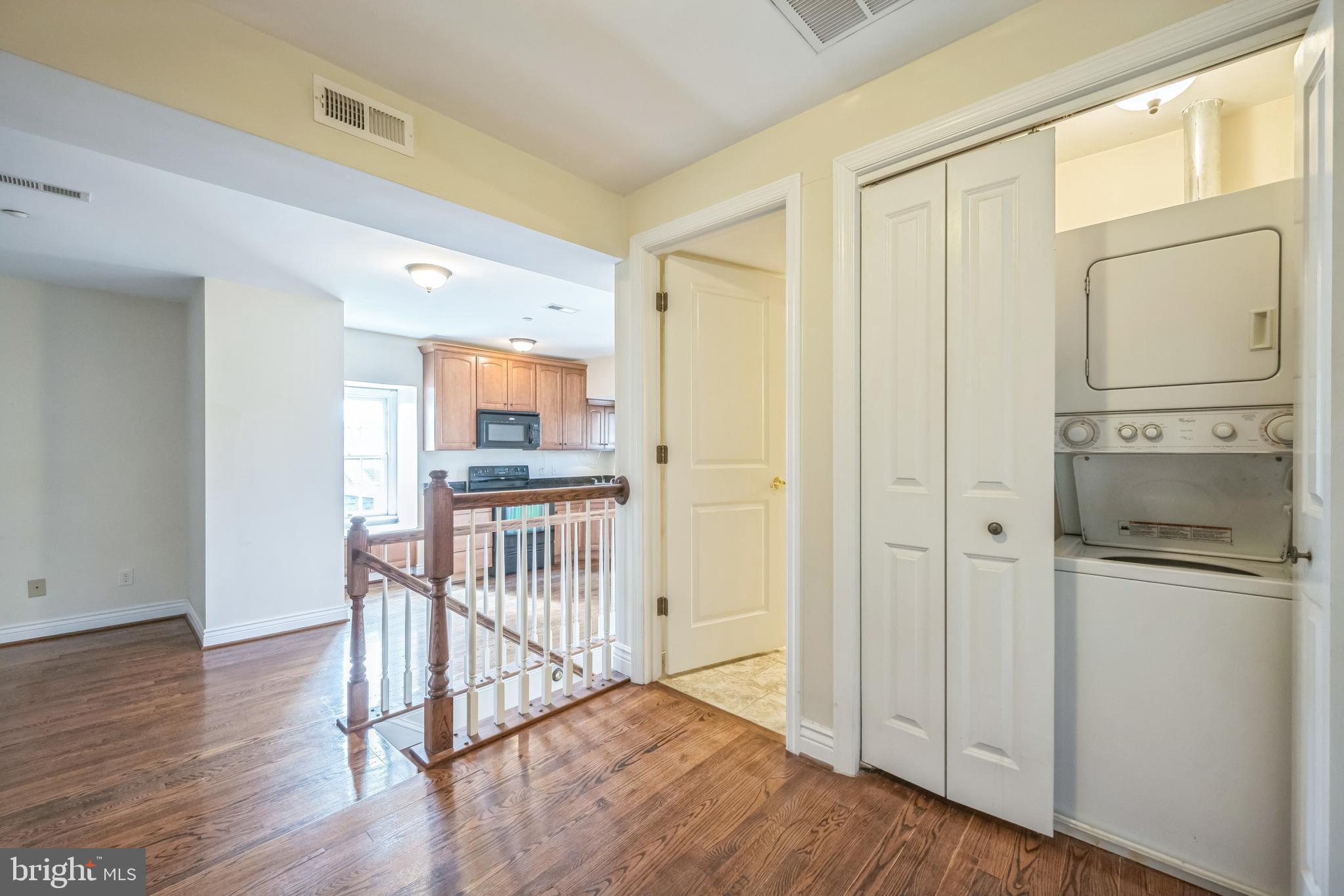 37 South Prospect Street, Unit 401 Hagerstown, MD 21740 - Photo 5 of 15 a view of a hallway with wooden floor and dining room