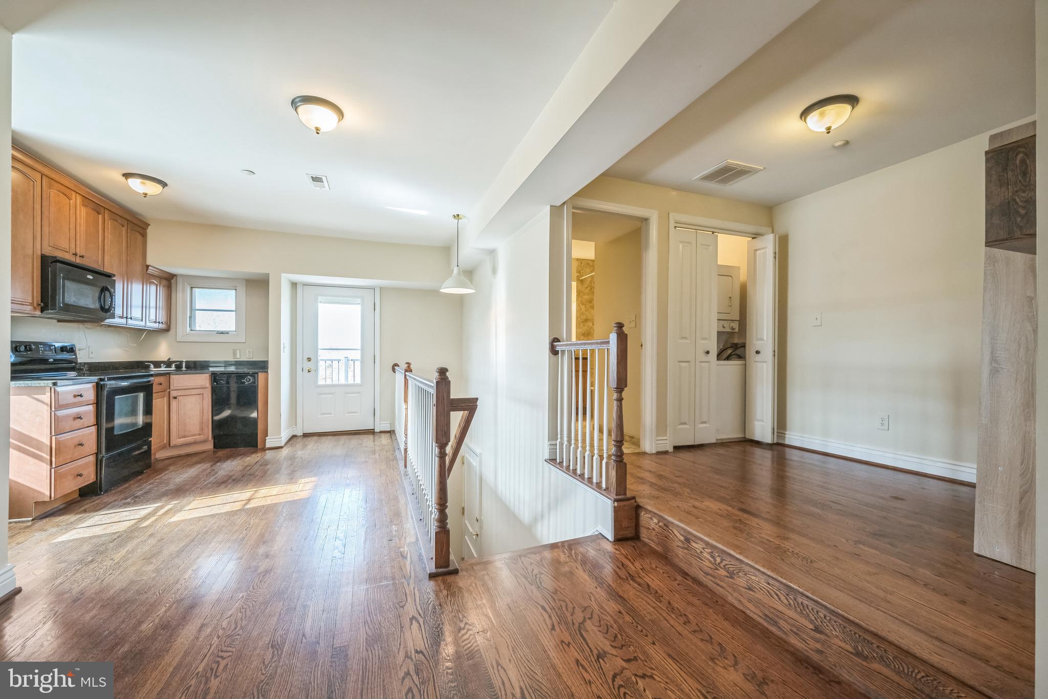 37 South Prospect Street, Unit 401 Hagerstown, MD 21740 - Photo 7 of 15 a view of a hallway with wooden floor and a living room