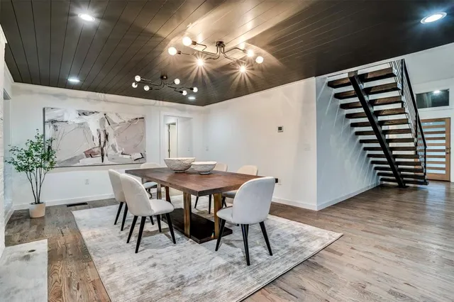 a large kitchen with a large counter top stainless steel appliances and a counter top space