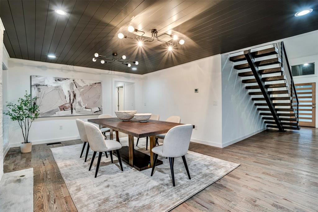 1408 South Alamo Road Rockwall, TX 75087 - Photo 14 of 40 a view of a dining room with furniture and wooden floor