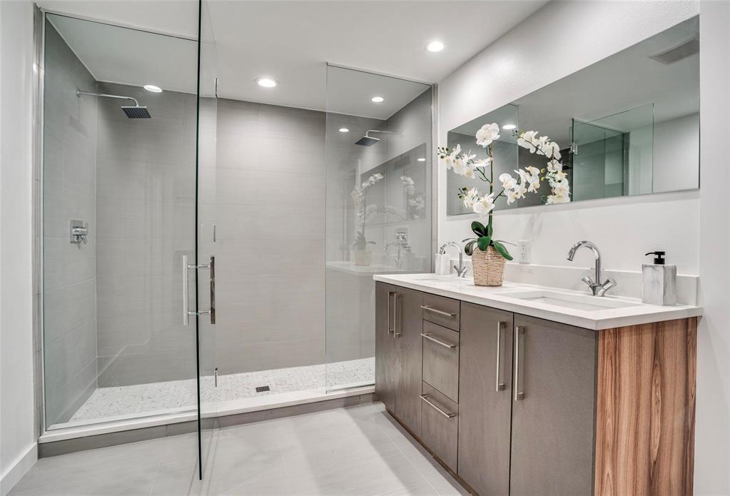 1408 South Alamo Road Rockwall, TX 75087 - Photo 17 of 40 a spacious bathroom with a shower sink and mirror