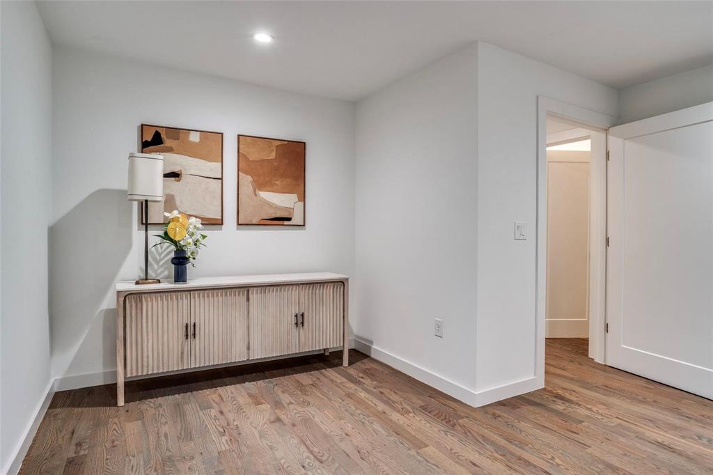 1408 South Alamo Road Rockwall, TX 75087 - Photo 19 of 40 a view of a livingroom with wooden floor