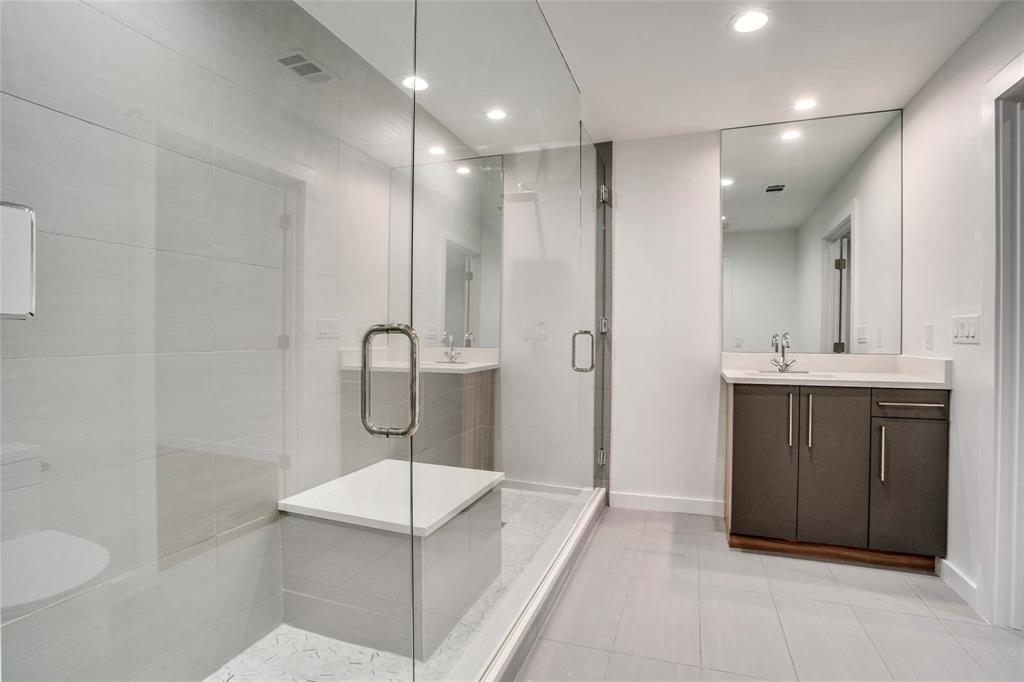 1408 South Alamo Road Rockwall, TX 75087 - Photo 26 of 40 a bathroom with a sink a toilet and shower