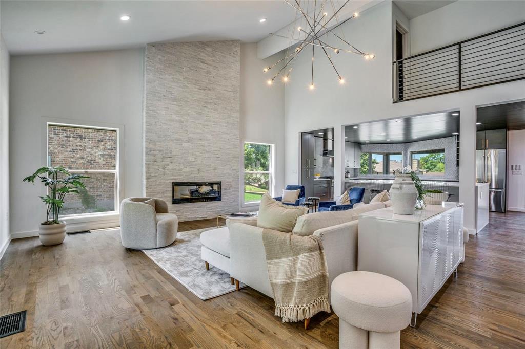 1408 South Alamo Road Rockwall, TX 75087 - Photo 3 of 40 a living room with furniture and a fireplace
