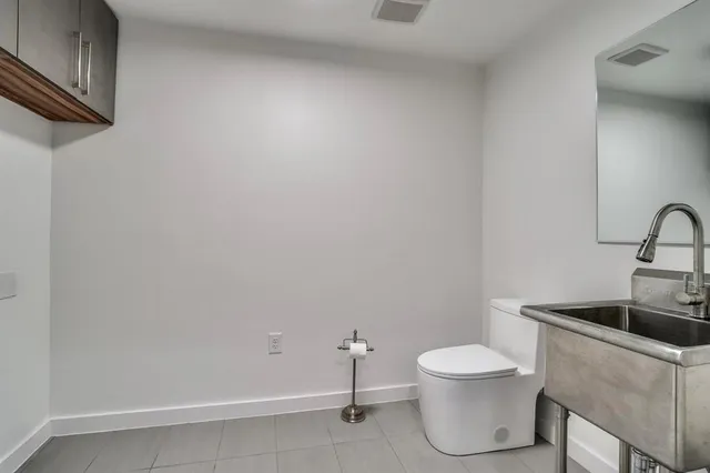 a bathroom with a toilet and sink