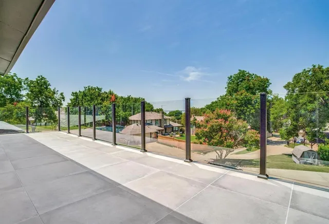 a view of a yard with potted plants