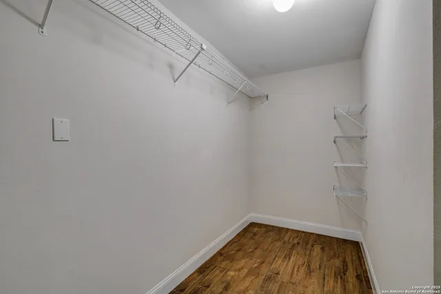 a view of a room with racks on the wall