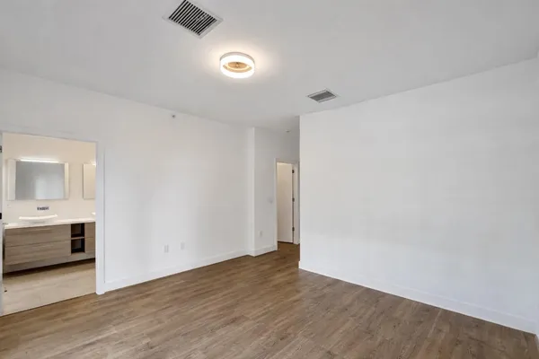 a bathroom with a double vanity sink mirror and toilet