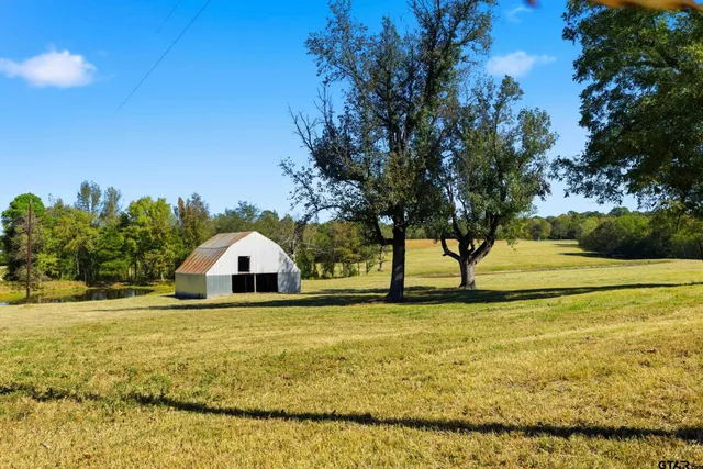 a view of swimming pool with an outdoor space and seating area