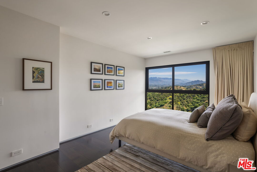3337 Beverly Ranch Road Beverly Hills, CA 90210 - Photo 28 of 36 a bedroom with a large bed and a large window