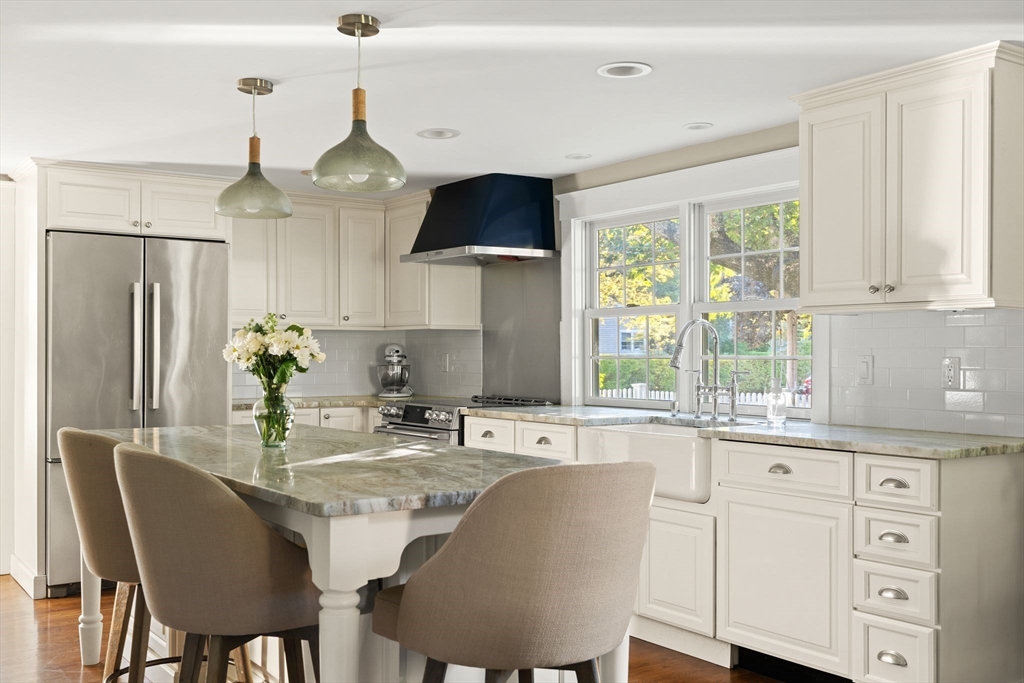 4 Windemere Park Extension Manchester, MA 01944 - Photo 2 of 41 a kitchen with stainless steel appliances granite countertop a sink a stove and a refrigerator