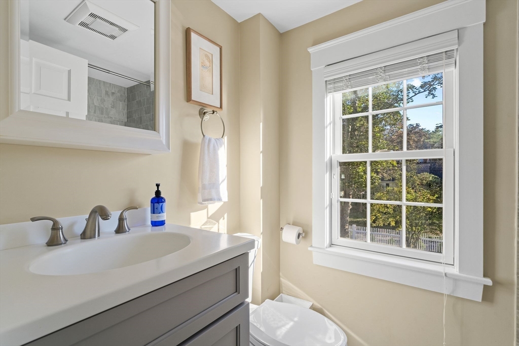 4 Windemere Park Extension Manchester, MA 01944 - Photo 26 of 41 a bathroom with a sink vanity mirror and toilet
