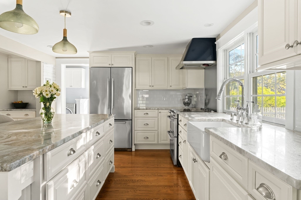 4 Windemere Park Extension Manchester, MA 01944 - Photo 3 of 41 a large kitchen with granite countertop a sink stainless steel appliances and cabinets