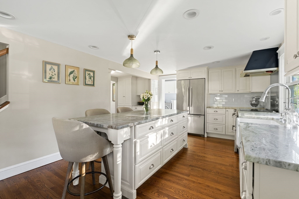 4 Windemere Park Extension Manchester, MA 01944 - Photo 6 of 41 a kitchen with stainless steel appliances granite countertop a sink and cabinets