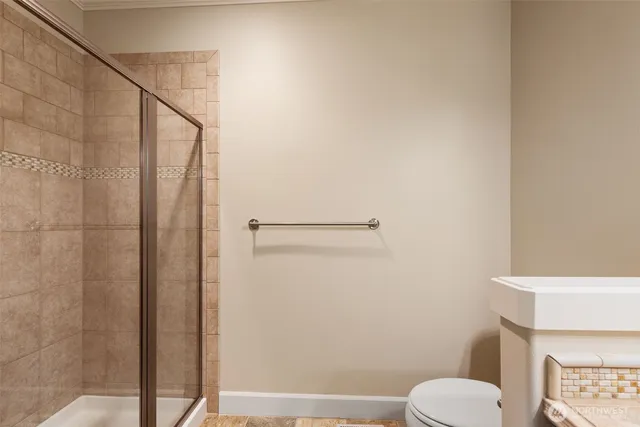 a white toilet sitting next to a bathroom sink