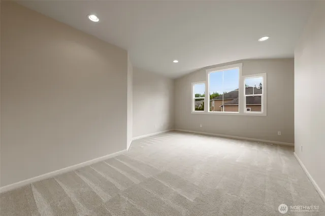 a view of empty room with windows