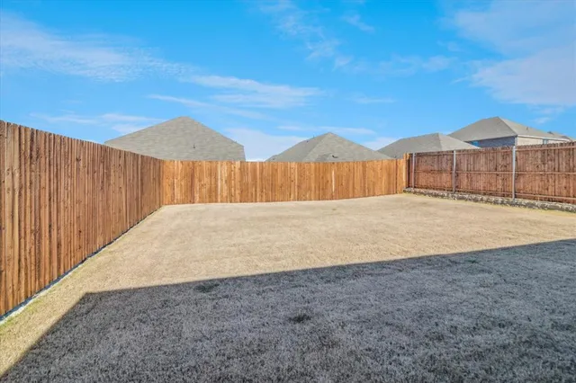 a view of backyard with a small space