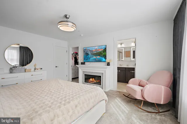 a bedroom with a bed and a fireplace