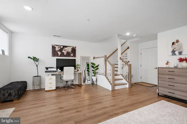 a workspace with furniture and wooden floor