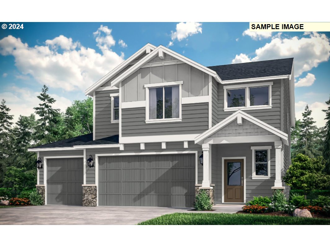 9015 South 2nd Street, Unit 126 Ridgefield, WA 98642 - Photo 1 of 17 a front view of a house with a yard and garage