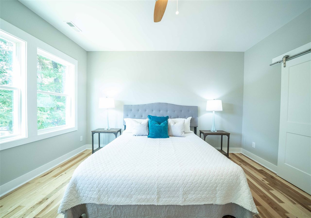 2318 Milburnie Road Raleigh, NC 27610 - Photo 11 of 28 a bedroom with a bed and window