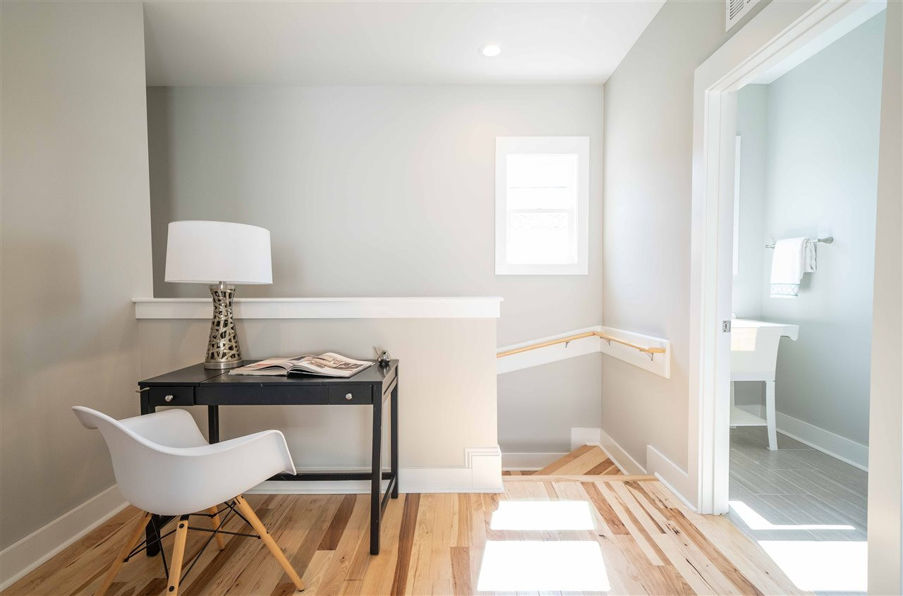 2318 Milburnie Road Raleigh, NC 27610 - Photo 20 of 28 a view of a room that has a bed and a chair in it