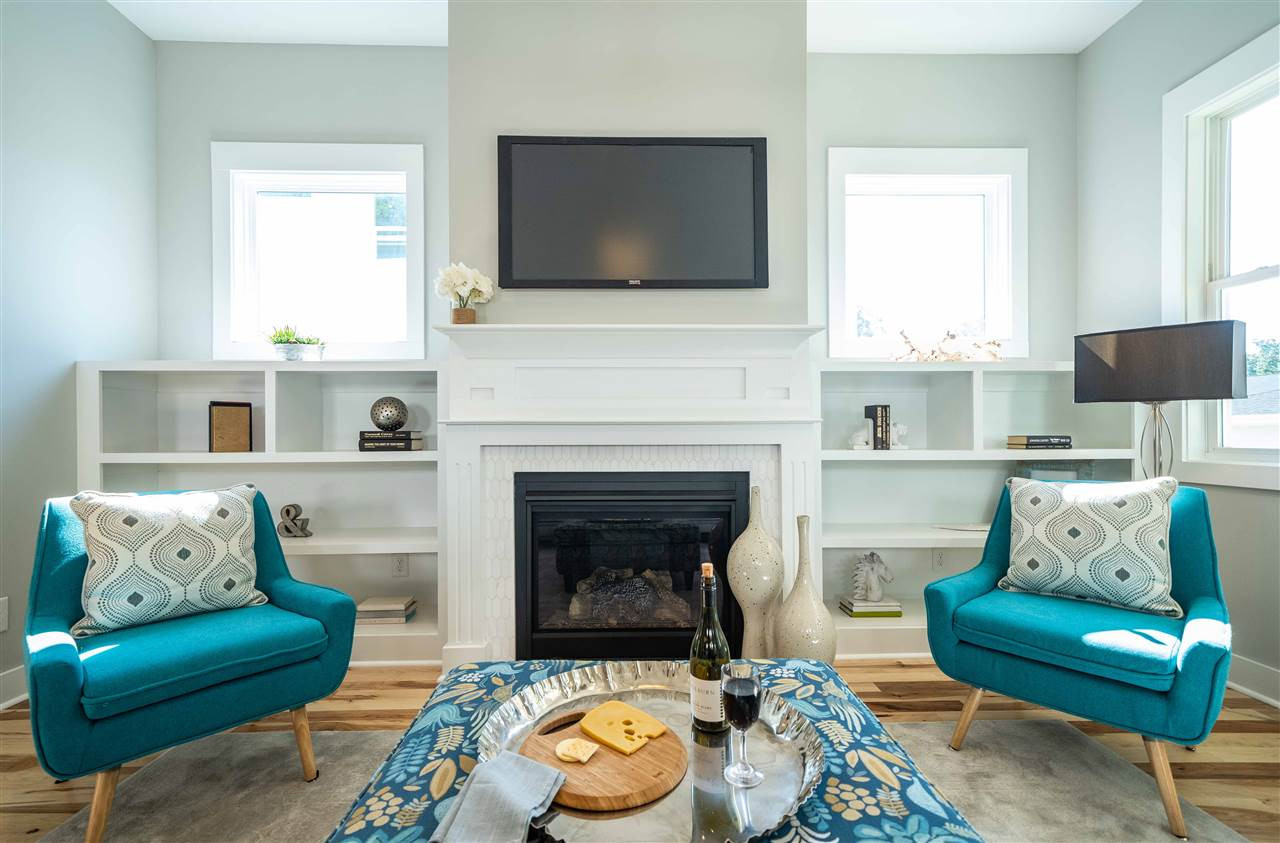 2318 Milburnie Road Raleigh, NC 27610 - Photo 6 of 28 a living room with furniture and a fireplace