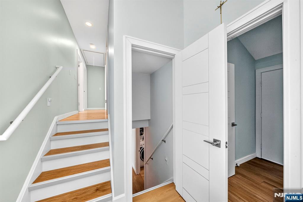 57 Hemlock Road Little Falls, NJ 07424 - Photo 19 of 50 a view of a hallway with a door and staircase