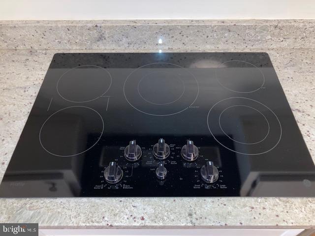 5902 Mt Eagle Drive, Unit 106 Alexandria, VA 22303 - Photo 20 of 73 Sleek GE Profile cooktop on elegant granite.