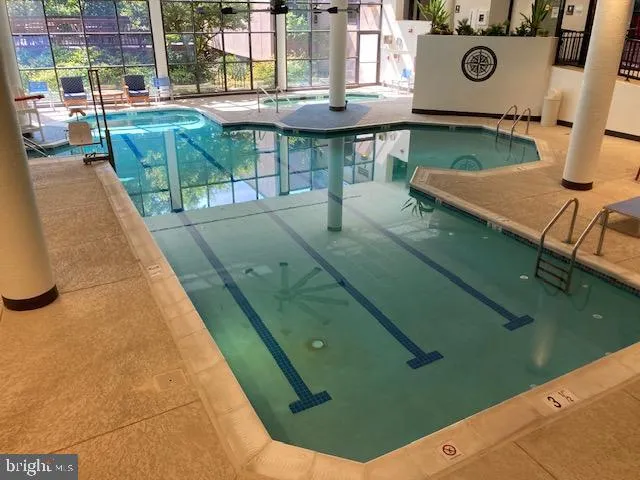 a red and white umbrella sitting in front of a building