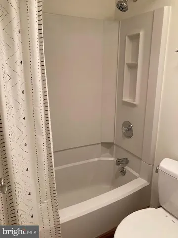 a view of a hallway with a tv