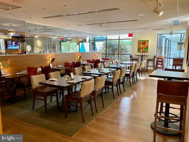 5902 Mt Eagle Drive, Unit 106 Alexandria, VA 22303 - Photo 62 of 73 a group of people sitting at tables in a room