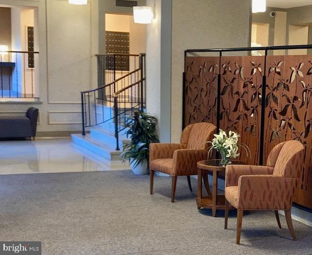 5902 Mt Eagle Drive, Unit 106 Alexandria, VA 22303 - Photo 10 of 73 a balcony with furniture and wooden floor