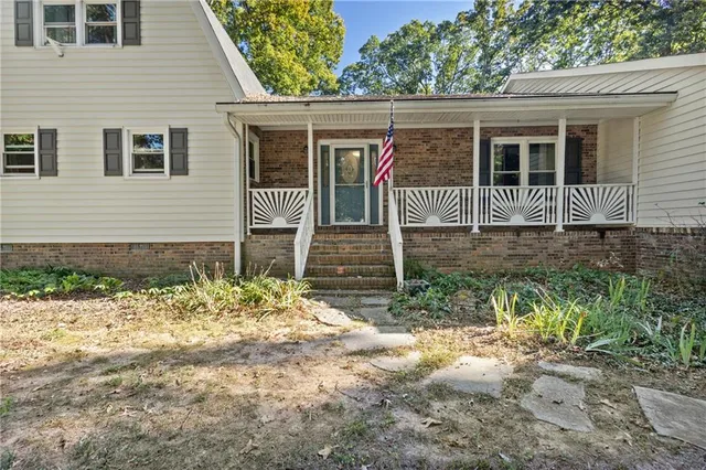 a front view of a house with garden