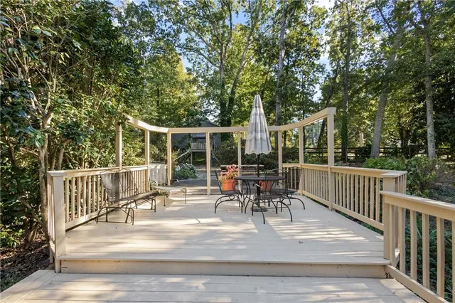 a view of a patio with a table and chairs