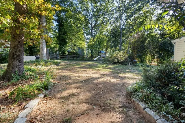 a view of outdoor space with trees all around
