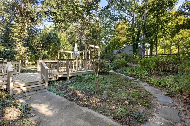 a view of a wooden deck with a trees