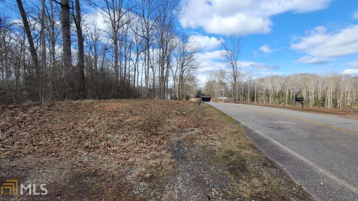 1580 Ebenezer Church Road Jefferson, GA 30549 - Photo 1 of 1 a view of dirt yard with a large tree