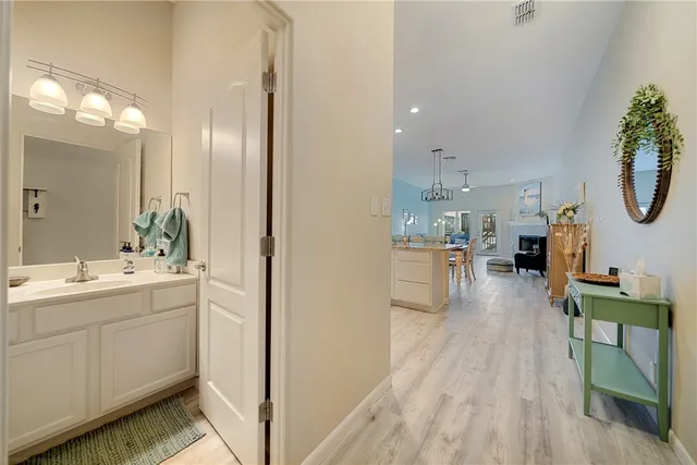 a view of a kitchen from the hallway