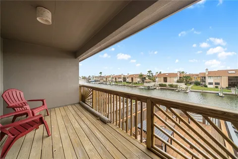 a view of balcony with furniture