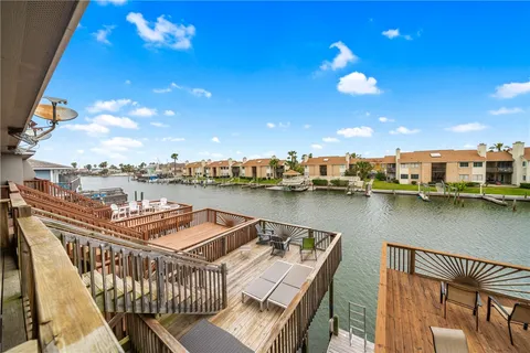 a view of a balcony with chairs