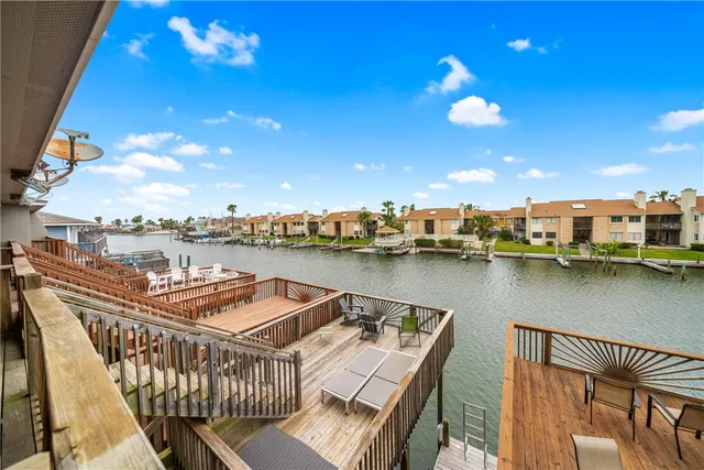 a view of a balcony with chairs